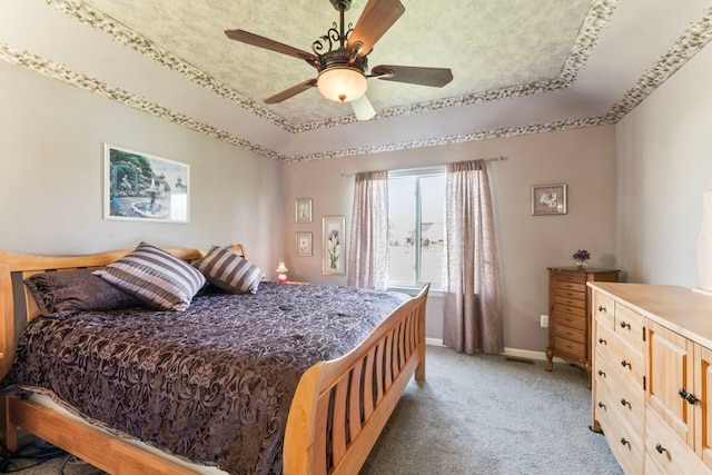 1355 Ridge View Ct, Grand Blanc, MI 48439 - bedroom with baseboards, ceiling fan, light carpet, and a tray ceiling