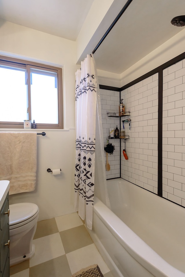 bathroom featuring vanity, tile patterned floors, shower / bath combo, and toilet