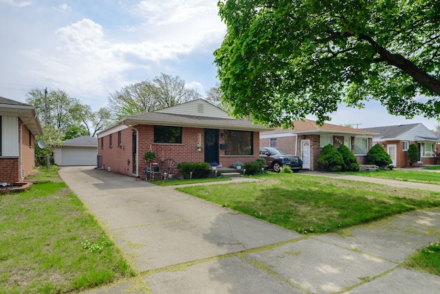 view of front facade featuring brick siding, a garage, a front lawn, and an outbuilding