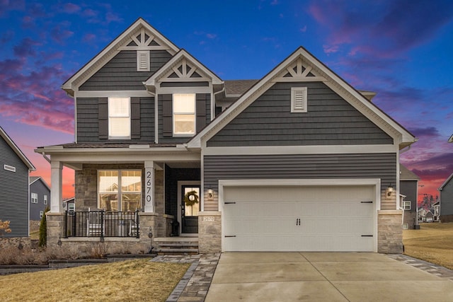 2670 Ironton Dr, Commerce Twp, MI 48382 - craftsman inspired home featuring a porch, a front yard, driveway, and stone siding