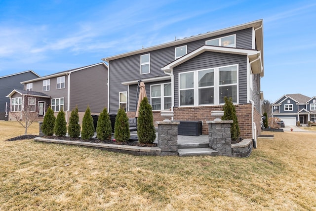 2670 Ironton Dr, Commerce Twp, MI 48382 - rear view of house with a lawn and brick siding