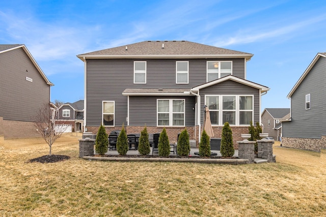 2670 Ironton Dr, Commerce Twp, MI 48382 - rear view of house featuring a patio, brick siding, and a yard