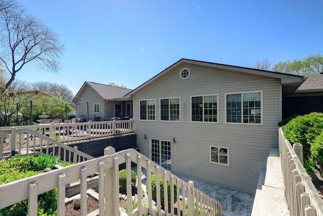 rear view of house with a deck