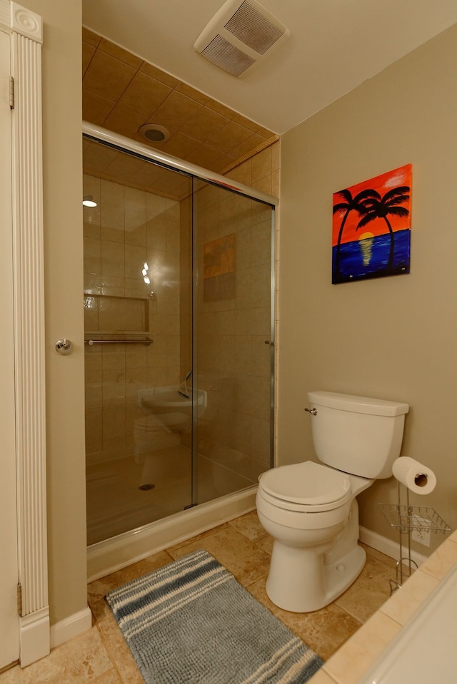 bathroom with toilet, tile patterned floors, visible vents, and a stall shower