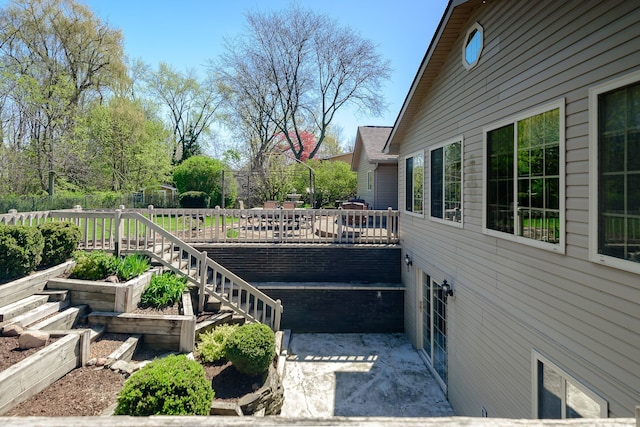 exterior space featuring fence and a wooden deck