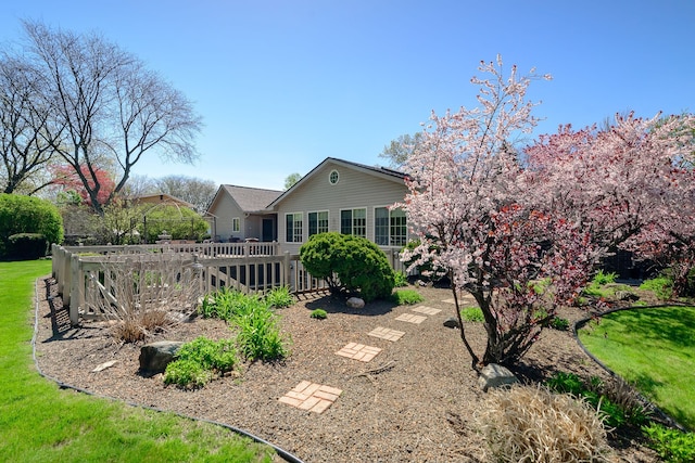 back of house with a wooden deck