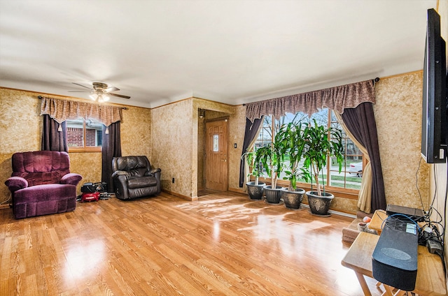 3440 Maidstone St, Trenton, MI 48183 - living room featuring baseboards, ceiling fan, wallpapered walls, and wood finished floors