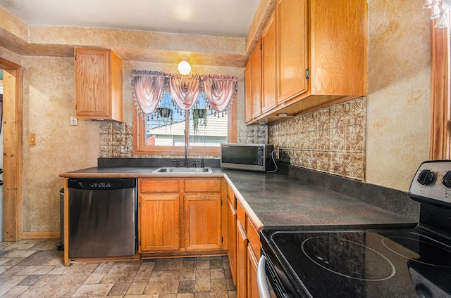 3440 Maidstone St, Trenton, MI 48183 - kitchen with stone finish flooring, dark countertops, appliances with stainless steel finishes, and a sink