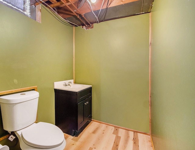 3440 Maidstone St, Trenton, MI 48183 - bathroom featuring vanity, toilet, and wood finished floors