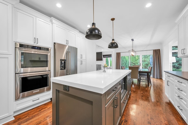 kitchen featuring dark wood-style floors, recessed lighting, white cabinets, and stainless steel appliances