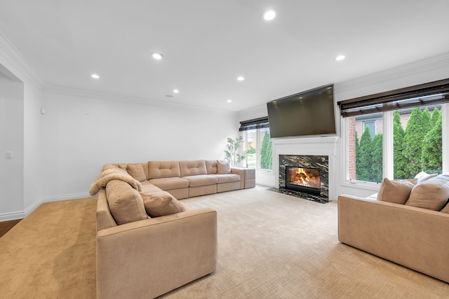 carpeted living area with crown molding, recessed lighting, baseboards, and a fireplace