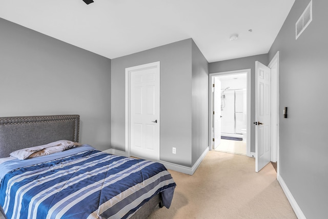 bedroom with visible vents, baseboards, and light carpet
