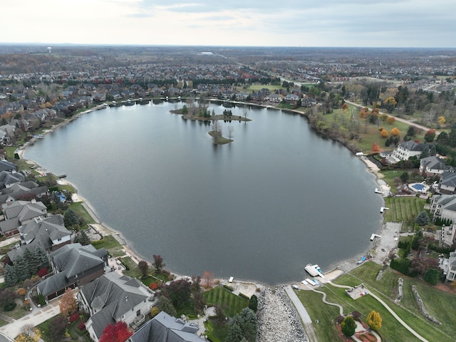 birds eye view of property featuring a residential view and a water view
