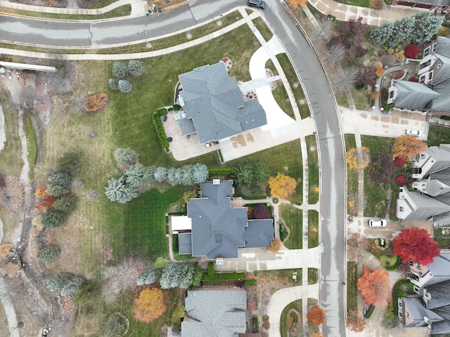 birds eye view of property with a residential view