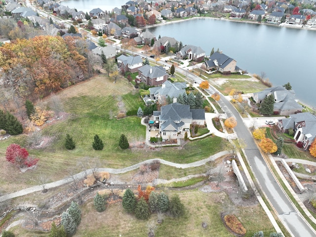 birds eye view of property featuring a residential view and a water view