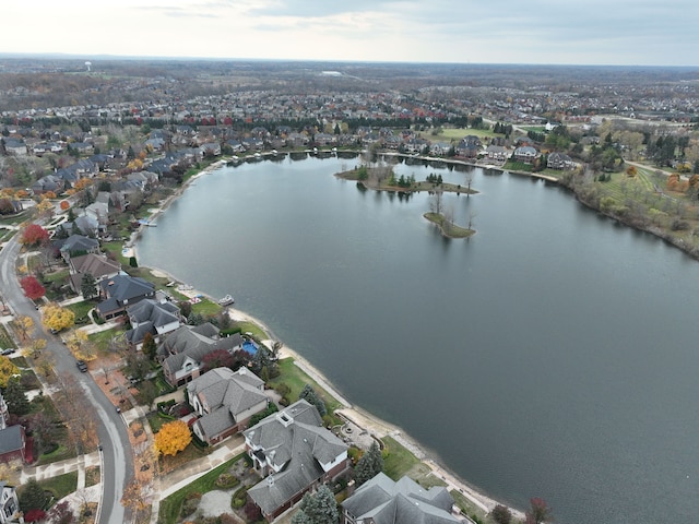 drone / aerial view featuring a water view and a residential view