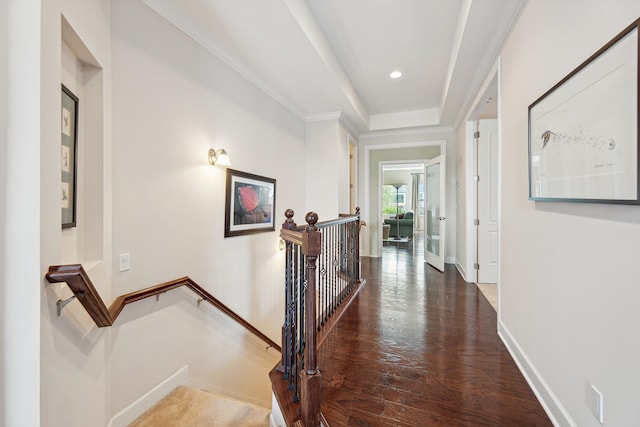 corridor with crown molding, recessed lighting, baseboards, an upstairs landing, and wood finished floors