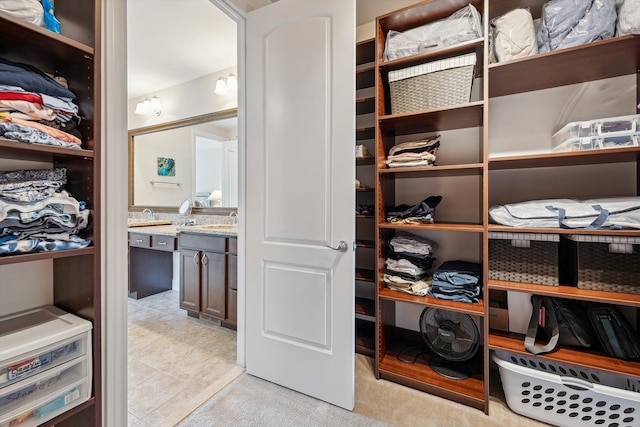 spacious closet featuring light tile patterned floors