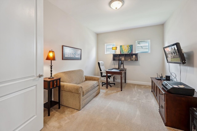 office area with baseboards and light carpet