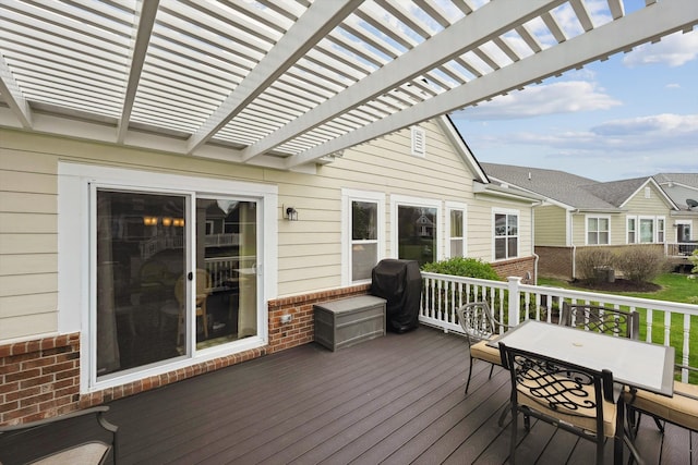 deck with a pergola and outdoor dining area