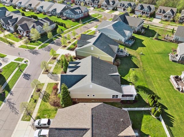 birds eye view of property with a residential view