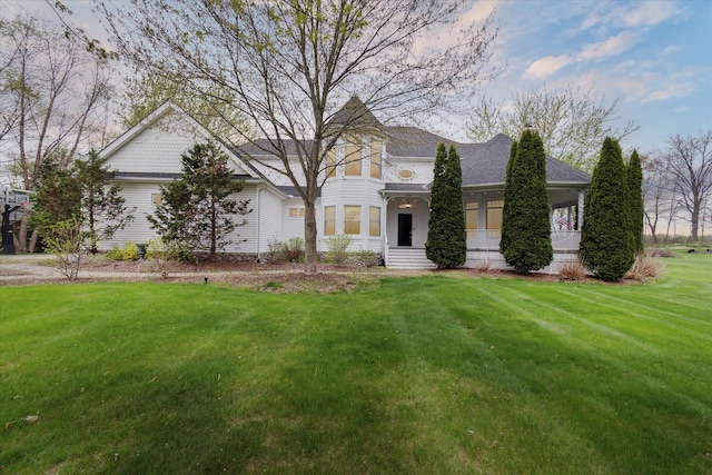 9730 Woodbend Dr, Saline, MI 48176 - view of front of home with roof with shingles, a chimney, and a front yard