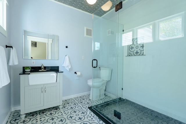 full bath with toilet, baseboards, a shower stall, and a healthy amount of sunlight