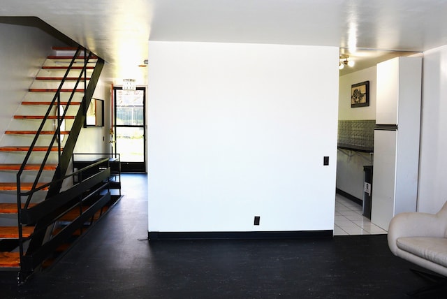 unfurnished living room with stairway