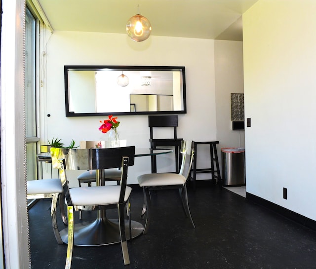 dining room with baseboards