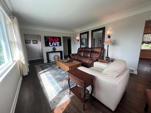 living room with visible vents, ornamental molding, dark wood-style flooring, and baseboards