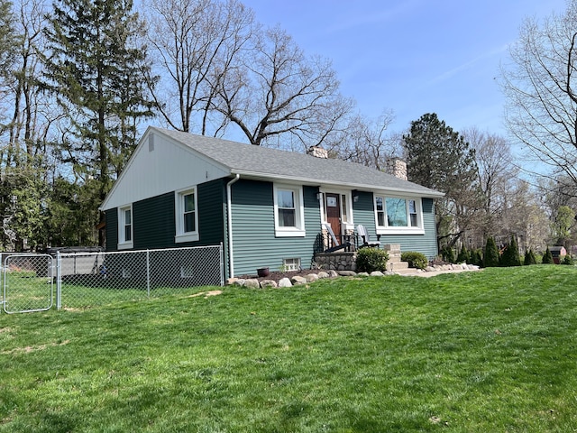 ranch-style home featuring a shingled roof, a front lawn, fence, and a chimney
