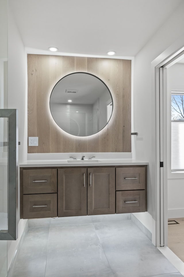 bathroom featuring vanity, recessed lighting, and visible vents
