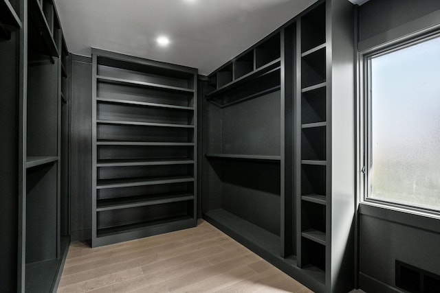 spacious closet with visible vents and wood finished floors