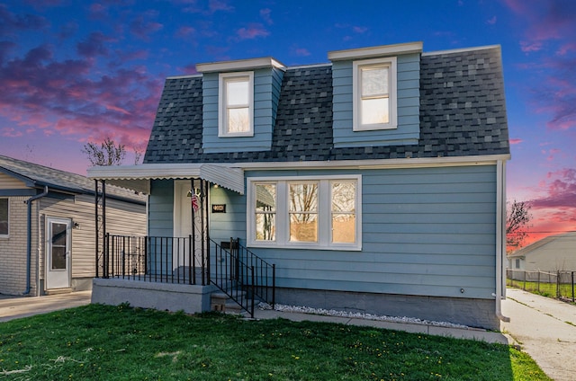 23040 Shakespeare Ave, Eastpointe, MI 48021 - view of front facade with a front yard and roof with shingles