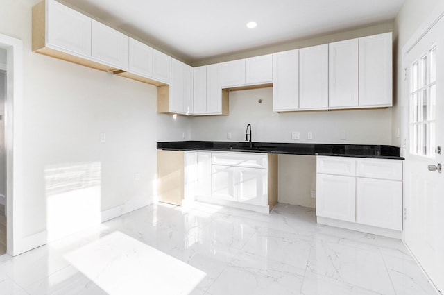 23040 Shakespeare Ave, Eastpointe, MI 48021 - kitchen featuring recessed lighting, marble finish floor, white cabinets, dark countertops, and a sink