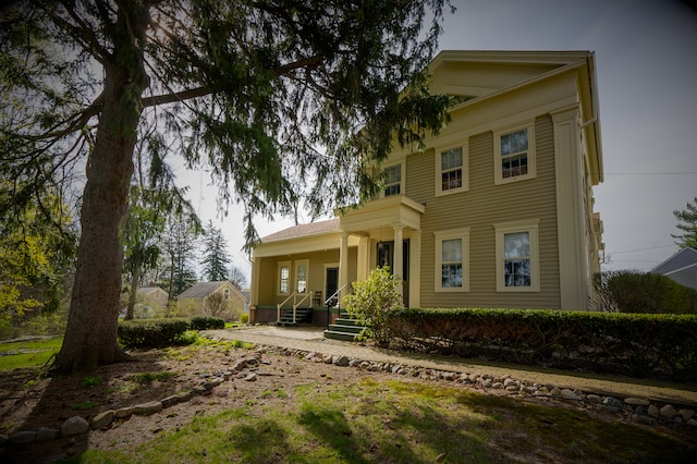 117 Bradley St, Romeo, MI 48065 - rear view of house featuring covered porch