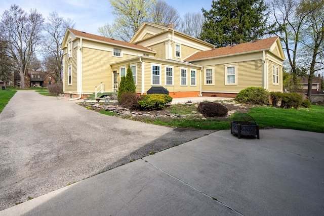 117 Bradley St, Romeo, MI 48065 - exterior space featuring an outdoor fire pit