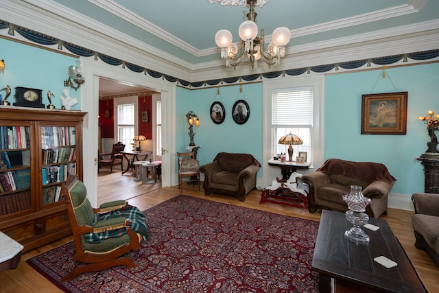 117 Bradley St, Romeo, MI 48065 - living room featuring ornamental molding, an inviting chandelier, wood finished floors, and plenty of natural light