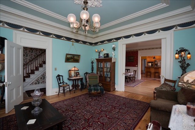117 Bradley St, Romeo, MI 48065 - living area with ornamental molding, an inviting chandelier, stairs, and wood finished floors