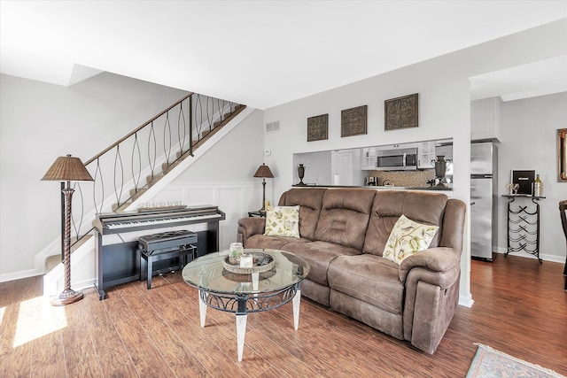 2993 Maplewood, Lake Orion, MI 48360 - living room featuring stairs, baseboards, visible vents, and wood finished floors