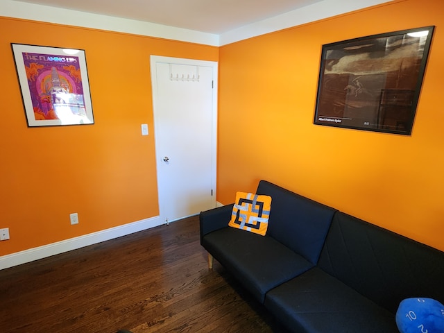 sitting room with wood finished floors and baseboards