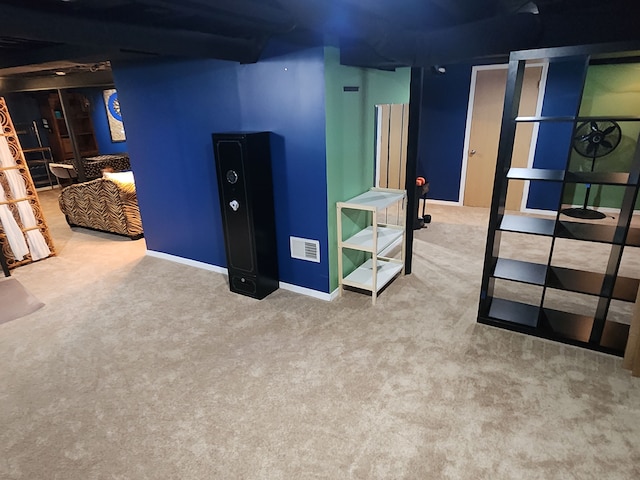 finished below grade area featuring carpet floors and baseboards