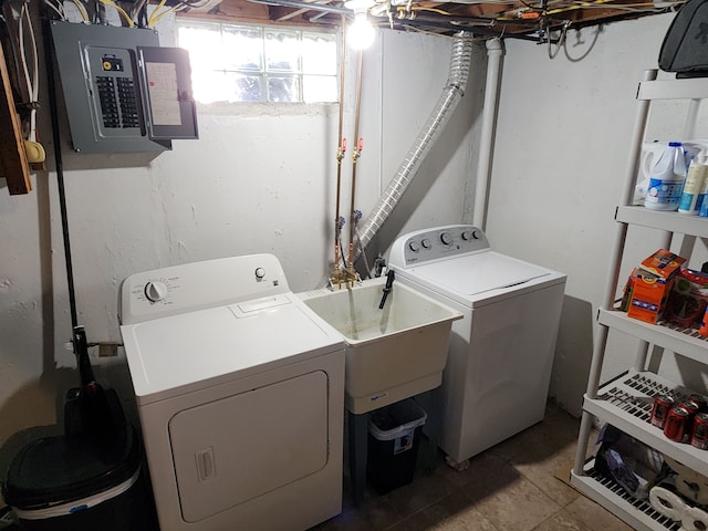 clothes washing area featuring washing machine and clothes dryer and electric panel
