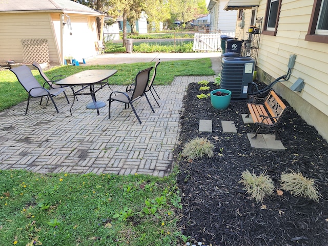 view of patio / terrace with cooling unit and fence