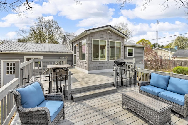 wooden deck with an outdoor living space