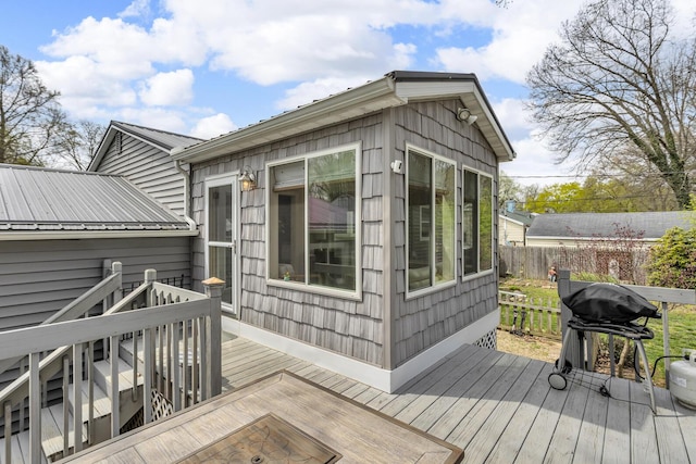 wooden deck featuring fence and area for grilling
