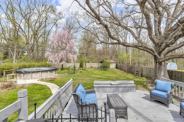 wooden terrace featuring a yard, a fenced in pool, and a fenced backyard