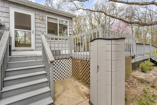 exterior space with stairway and a wooden deck