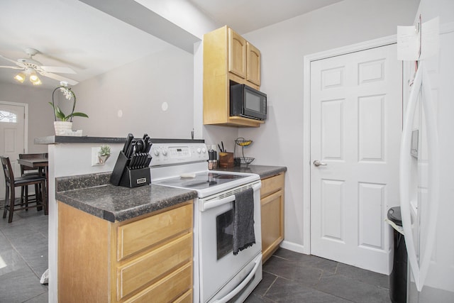 kitchen featuring light brown cabinets, dark countertops, black microwave, white range with electric cooktop, and a ceiling fan