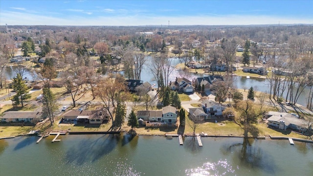 bird's eye view with a residential view and a water view